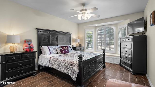 bedroom featuring dark hardwood / wood-style floors and ceiling fan