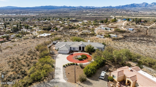 birds eye view of property with a mountain view