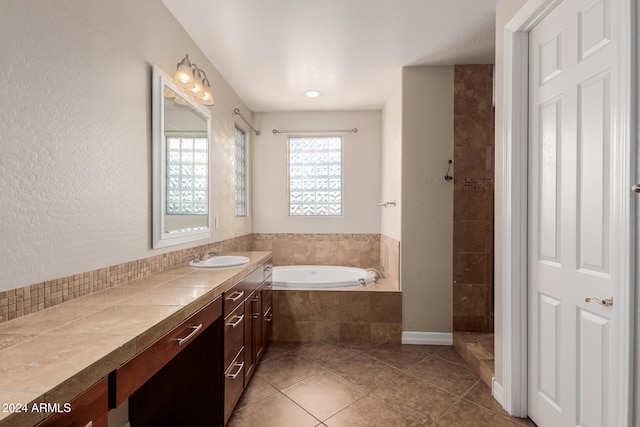 bathroom with vanity, tile patterned floors, and independent shower and bath