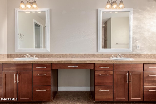 full bath with vanity and tile patterned floors