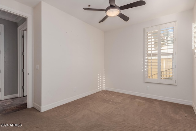 unfurnished room featuring ceiling fan, baseboards, and carpet