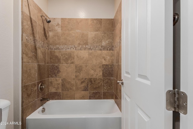 bathroom featuring toilet and shower / washtub combination