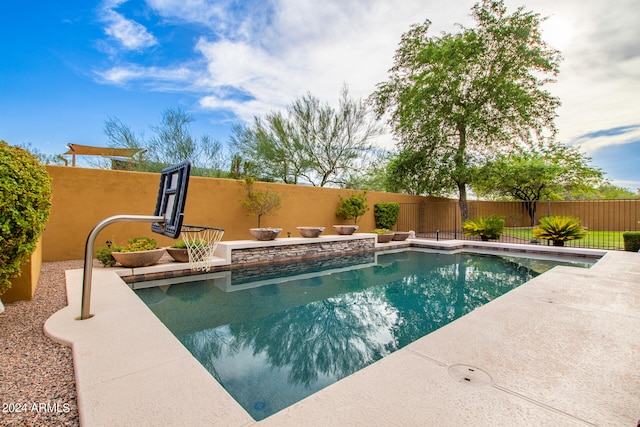 view of swimming pool with a fenced backyard and a fenced in pool