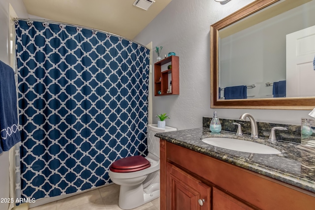 bathroom with visible vents, a shower with shower curtain, toilet, vanity, and tile patterned flooring