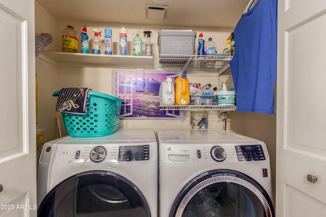 laundry area with laundry area and washer and dryer