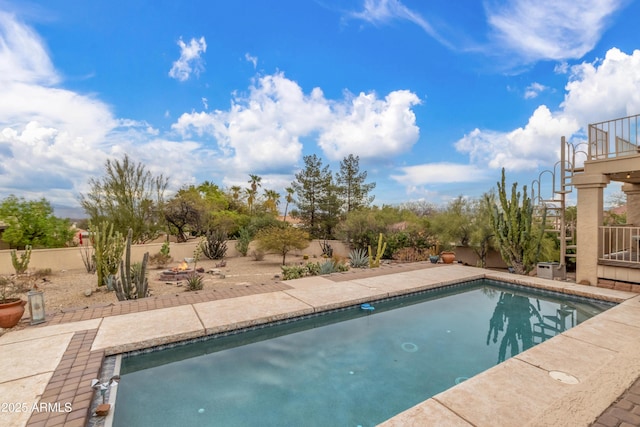 view of swimming pool featuring a fenced in pool and fence