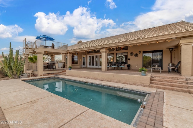 exterior space with french doors and a patio area