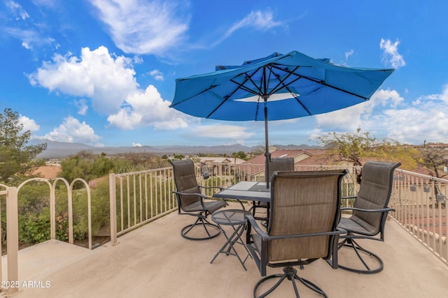 view of patio featuring outdoor dining area and a mountain view