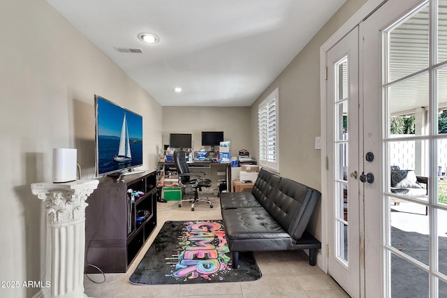 office area featuring tile patterned flooring, visible vents, a wealth of natural light, and french doors