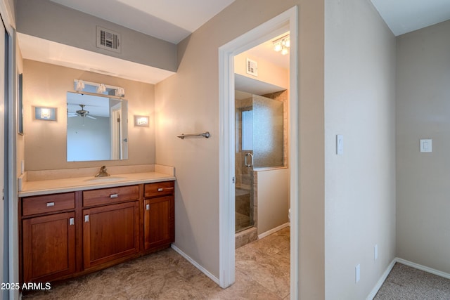 full bath featuring visible vents, a stall shower, vanity, and baseboards