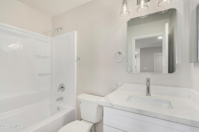 bathroom featuring shower / washtub combination, vanity, and toilet