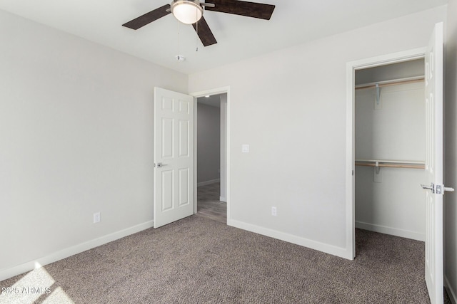 unfurnished bedroom featuring carpet, a closet, and baseboards