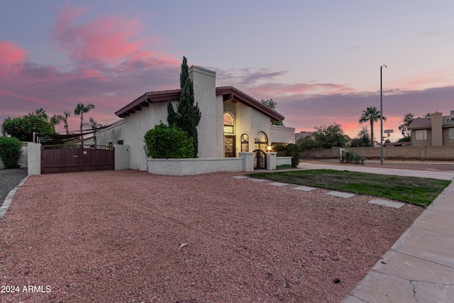 view of property exterior at dusk