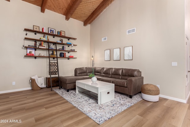 living room with beamed ceiling, wood ceiling, high vaulted ceiling, and light hardwood / wood-style flooring