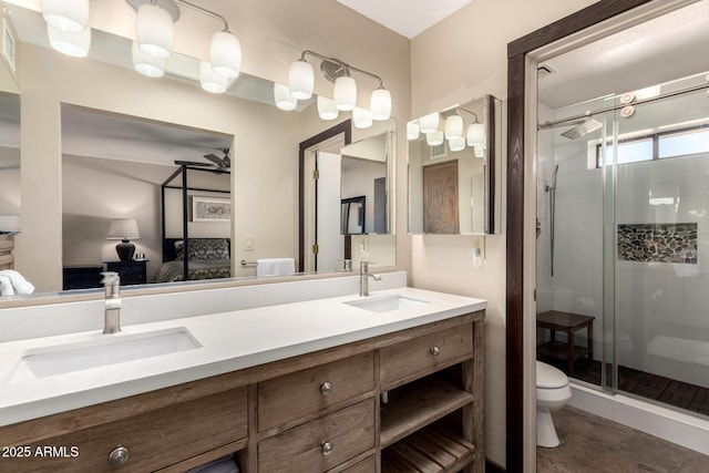 bathroom with connected bathroom, a sink, a shower stall, and toilet