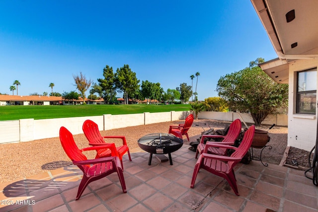 view of patio / terrace with an outdoor fire pit and a fenced backyard