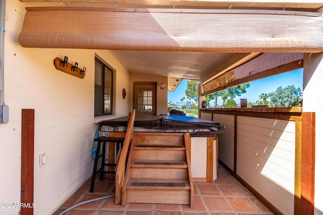 view of patio with a covered hot tub