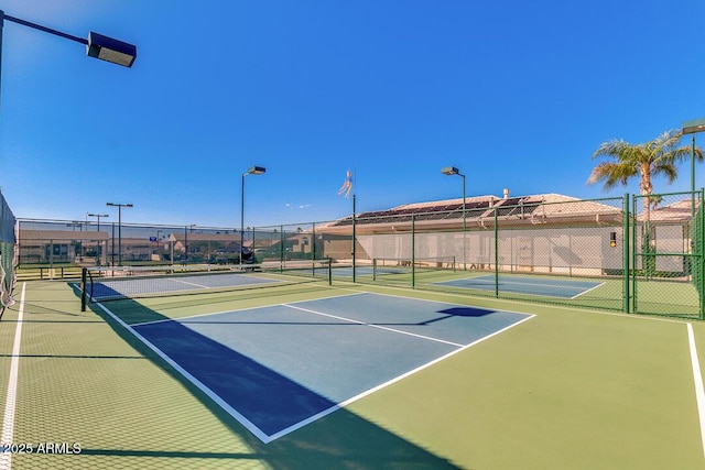 view of sport court with community basketball court and fence