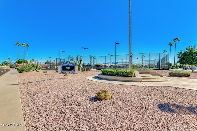 view of property's community with fence