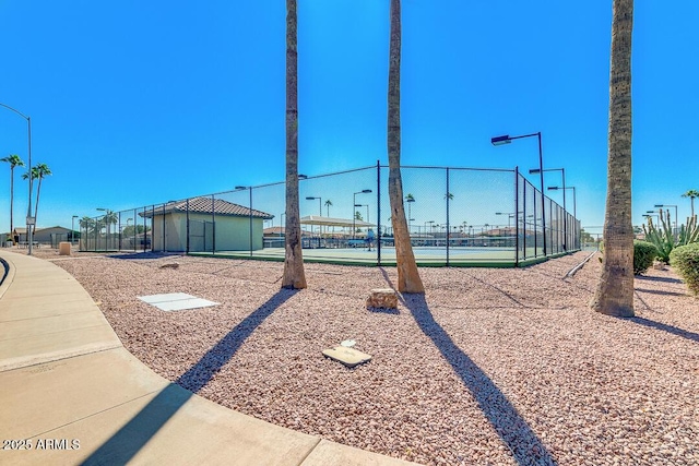 view of property's community featuring fence