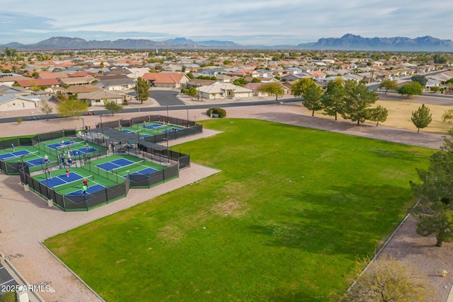 drone / aerial view featuring a residential view and a mountain view