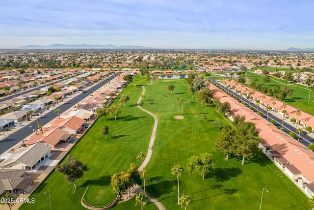 aerial view featuring a residential view, a water view, and golf course view