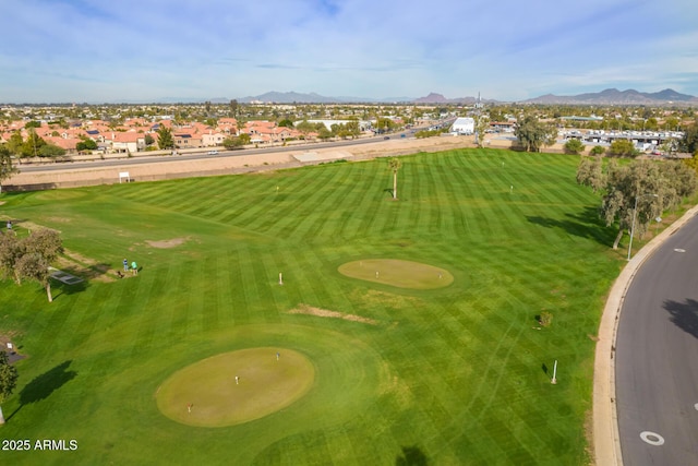 birds eye view of property with a residential view, a mountain view, and golf course view