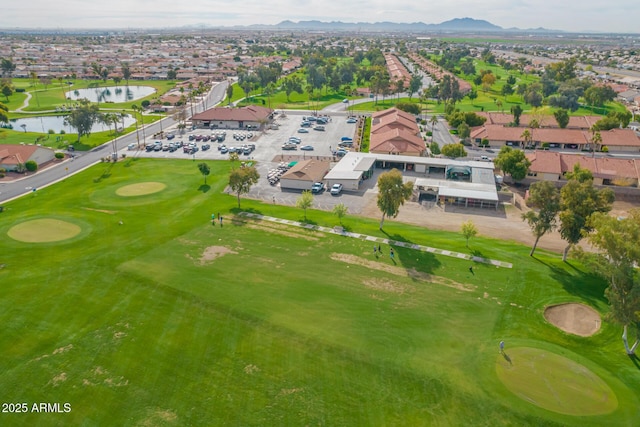 aerial view featuring a mountain view and golf course view