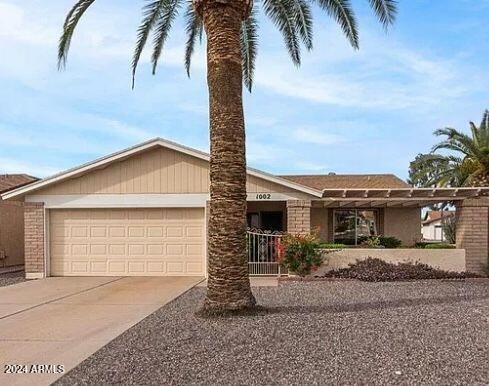 ranch-style house featuring a garage