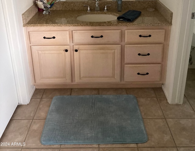 details featuring vanity and tile patterned floors