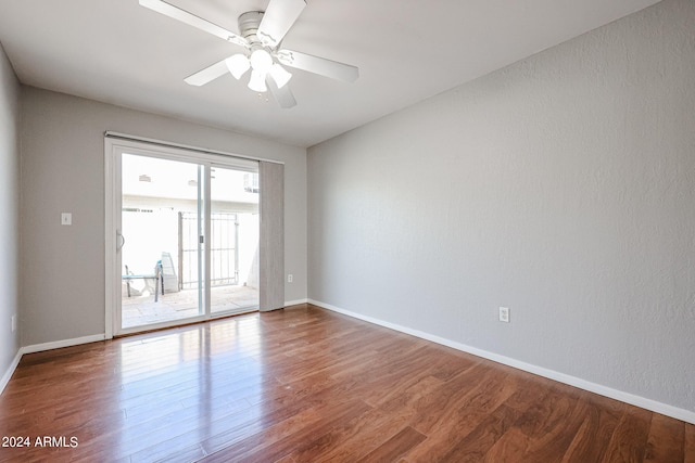 empty room featuring ceiling fan and hardwood / wood-style flooring