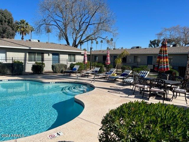 view of swimming pool featuring a patio area