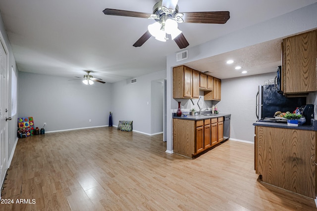 kitchen featuring black appliances, ceiling fan, light hardwood / wood-style flooring, and sink