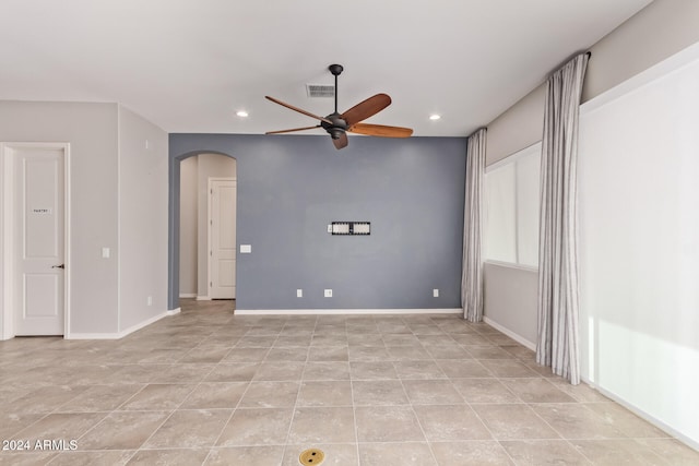 unfurnished room featuring ceiling fan and light tile patterned floors