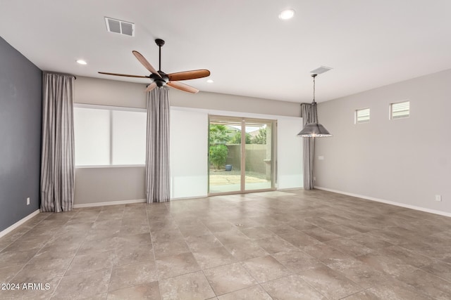 unfurnished room featuring ceiling fan