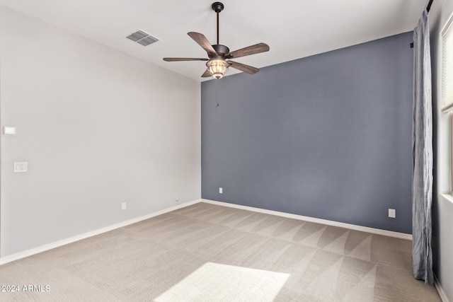 carpeted empty room with ceiling fan