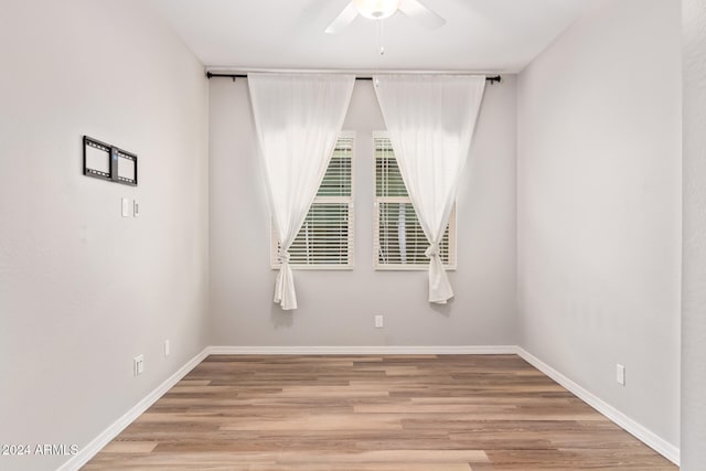 empty room featuring ceiling fan and light hardwood / wood-style floors