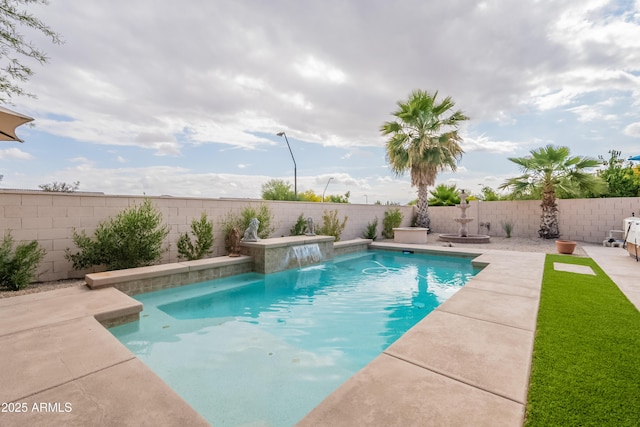 view of swimming pool with a fenced backyard and a patio area