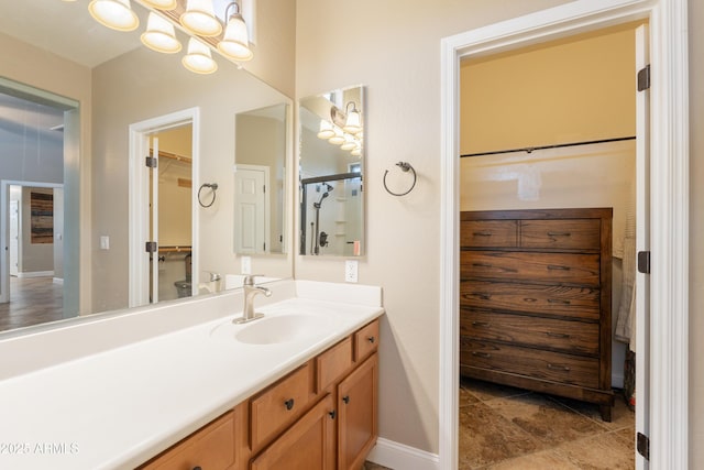 bathroom featuring vanity and baseboards
