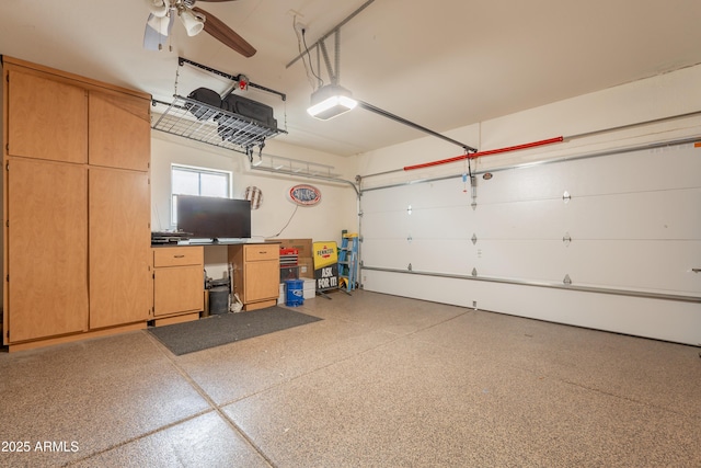 garage featuring a garage door opener and ceiling fan