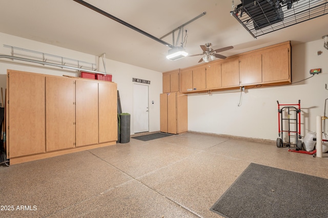 garage featuring a garage door opener and ceiling fan
