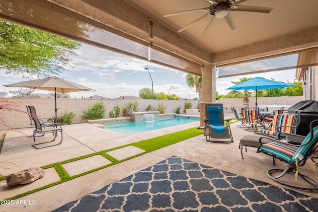 view of pool with ceiling fan, a fenced backyard, and a patio