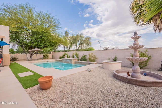 view of swimming pool featuring a patio area and a fenced backyard