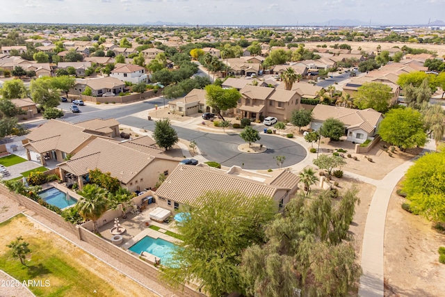 aerial perspective of suburban area featuring a pool area