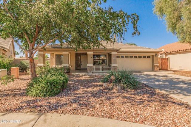 29900 N Maravilla Dr, San Tan Valley, AZ 85143 - view of front of home with fence, covered porch, concrete driveway, a garage, and stone siding