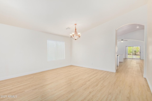 29900 N Maravilla Dr, San Tan Valley, AZ 85143 - spare room featuring visible vents, baseboards, light wood-style floors, arched walkways, and a notable chandelier