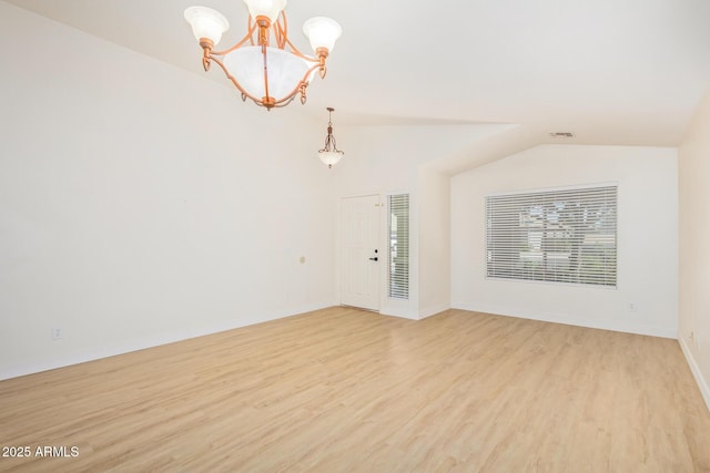 29900 N Maravilla Dr, San Tan Valley, AZ 85143 - spare room with baseboards, visible vents, lofted ceiling, light wood-style floors, and a notable chandelier