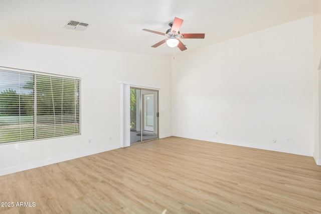 29900 N Maravilla Dr, San Tan Valley, AZ 85143 - spare room featuring light wood-type flooring, visible vents, baseboards, and a ceiling fan