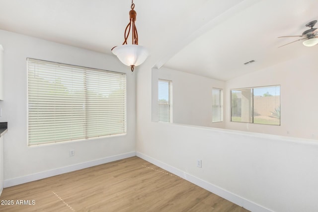 29900 N Maravilla Dr, San Tan Valley, AZ 85143 - unfurnished dining area featuring visible vents, lofted ceiling, wood finished floors, baseboards, and ceiling fan