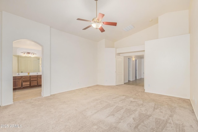 29900 N Maravilla Dr, San Tan Valley, AZ 85143 - interior space featuring visible vents, carpet floors, ensuite bathroom, arched walkways, and high vaulted ceiling